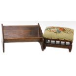 A small late Victorian walnut footstool, with embroidered seat and a book rack. (2)