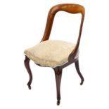A Victorian mahogany spoon back dining chair, with a padded seat on cabriole legs.