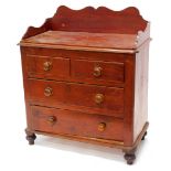A Victorian pine wash stand, with a shaped gallery above two short and two long drawers, each with