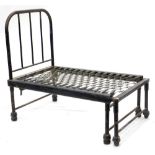 An unusual Victorian black painted iron adjustable campaign type bed, 113cm x 70cm enclosed.