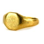 A 9ct gold signet ring, with hexagonal shield and rubbed initials and partially decorated but rubbed