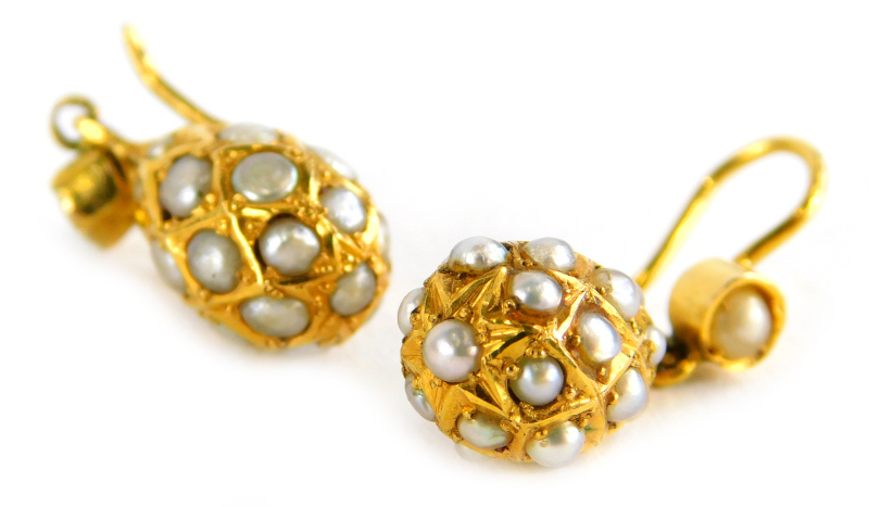 A pair of seed pearl bead earrings, each with drop bead Eastern design, in yellow metal frame,