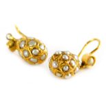 A pair of seed pearl bead earrings, each with drop bead Eastern design, in yellow metal frame,