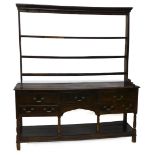 A late 18th/early 19thC oak dresser, the associated raised back with three plate shelves, the base