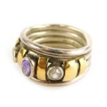 A dress ring, set with oval cut amethyst and two round brilliant cut diamonds, with yellow gold