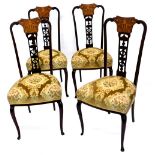 A set of four Edwardian mahogany salon type chairs, each with marquetry and pierced splats in the