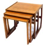A nest of three G-plan teak tables, each of rectangular form, on end supports, the largest 53cm