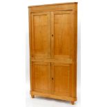 A 19thC/ early 20thC German ash standing corner cupboard, with two panelled doors on tapering