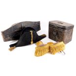 A Naval bicorn hat, with a fitted toleware case, and a pair of Epaulettes in toleware box stamped H.