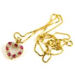 A 9ct gold pendant and chain, the heart shaped pendant set with garnets and CZ stones, 1.2cm wide,