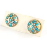 A pair of silver gilt and enamel earrings, each with blue and white enamel, with screw on backs.