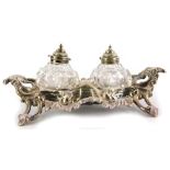 A Victorian silver ink stand, with rococo casting, insert with two cut glass inkwells, each with a
