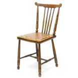 An early 20thC Windsor type kitchen chair, with a brown leatherette type padded seat, on turned