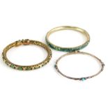 Three bangles, to include a silver bangle set with turquoise stones, 6.5cm diameter, a silver gilt