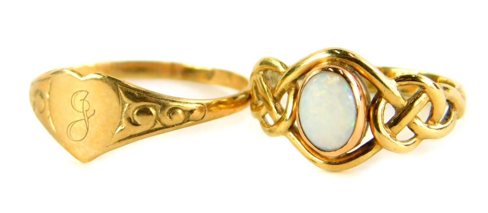 Two dress rings, to include a 9ct gold opal set dress ring, with weave design shoulders, ring size