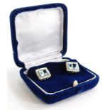 A pair of aquamarine and diamond earrings, the central rectangular cut stone in claw setting,