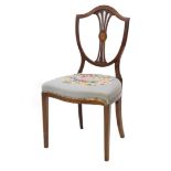 An Edwardian mahogany and boxwood strung side chair, the shield shaped back with a pierced splat and