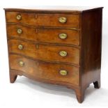 A George III mahogany and boxwood strung serpentine fronted chest, the top with a crossbanded