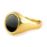 A 9ct gold gents signet ring, with oval onyx set panel, on a misshapen band, ring size X½, 5.4g