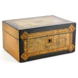 A Victorian walnut and ebonised work box, with parquetry borders, the hinged lid enclosing a