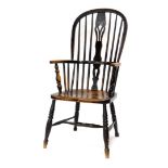 A 19thC ash and elm Windsor chair, with a pierced splat, solid seat and turned arm supports, with