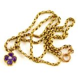 An amethyst and diamond set four leaf clover pendant and chain, the clover 1cm wide, on a fancy link