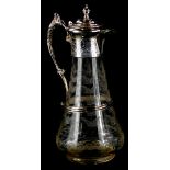 A late 19thC glass claret jug, with engraved decoration of leaves, the silver plated mount decorated