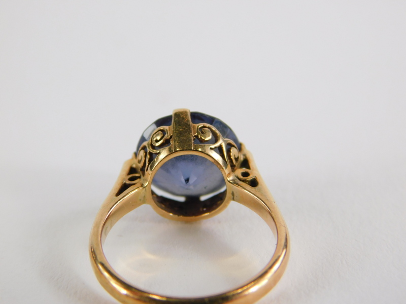 An amethyst dress ring, with oval cut stone in four claw setting, the raised basket weave surrounded - Image 2 of 2