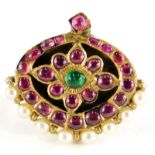 An Indian design dress ring, converted from an oval pendant set with rough cut rubies and