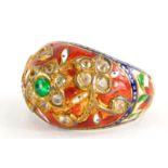 An Indian enamel and gem set ring, the ring set with central cabochon green emerald, in a floral