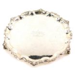 An Elizabeth II silver salver, the shaped piecrust border cast with shells, etc., engraved to the