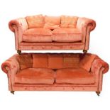 Two pink velour upholstered Chesterfield sofas, in Victorian style one of three seat form with