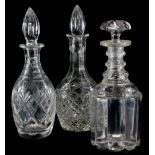 A 19thC triple ring neck decanter and stopper, 27cm high, and two other decanters. (3)