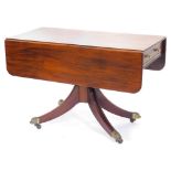 An early 19thC Pembroke table, the rectangular top with rounded corners, on a central pedestal and