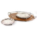 A late 19th/early 20thC oak oval two handled galleried tray, with silver plated mounts, 62cm wide,
