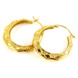 A pair of 9ct gold hoop earrings, each with hammered decoration, 2cm wide, 2.1g.