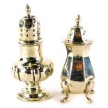 A George V silver pepper pot, Birmingham 1916, and another, indistinctly hallmarked, 1½oz, (AF, 2).