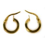 A pair of 9ct gold hoop earrings, 1cm wide, 0.8g.
