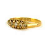 A Victorian 18ct gold gypsy ring, set with three diamonds, ring size R, Birmingham, 2.3g all in.