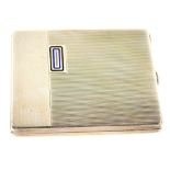 An Art Deco continental white metal cigarette case, with engine turned and enamel decoration, the