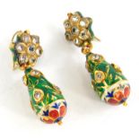 A pair of diamond and enamel drop earrings, the top in the form of a floral cluster set with seven