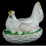 A 19thC Staffordshire hen shaped egg tureen, decorated in gilt, unmarked, 18cm wide.