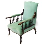 A late 19th/early 20thC mahogany armchair, upholstered in turquoise fabric with shaped arms, each