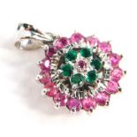 A cluster pendant, set with garnets and emeralds, in a floral cluster, in white metal setting,