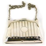 A George VI silver coin purse, with engine turned body, vacant cartouche and plain chain handle, (