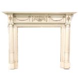 A cream painted pine and gesso fireplace in Adam style, the mantel with a moulded edge above a