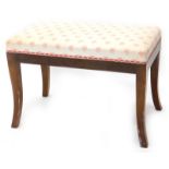A mahogany dressing stool, with a padded seat on splayed legs.
