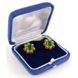 A pair of emerald and diamond cluster earrings, each set with central cabochon cut emerald with
