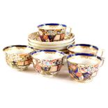 A set of five 19thC Derby porcelain cups and saucers, each decorated in Imari colours, handwritten