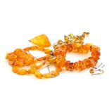 A group of imitation amber jewellery, to include pendant and chain, bracelet, necklace, etc. (1